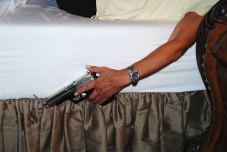 Defender Gun Holster simply slips between your mattress and box spring 