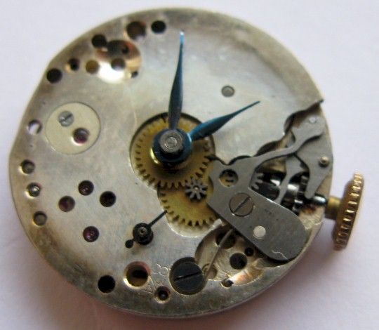 Diameter 19.7 mm watch movement for parts or project.