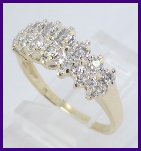   gold diamond anniversary band this ring has 14 round cut diamonds that